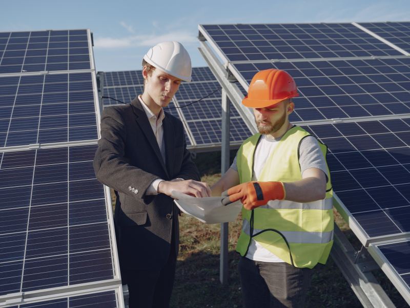 Engineers reviewing solar panels installed by leading Solar Panel Manufacturers in the world